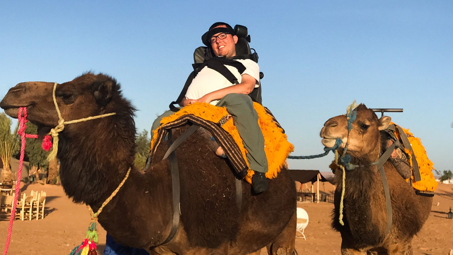 Cory Lee rides a camel during his travels.