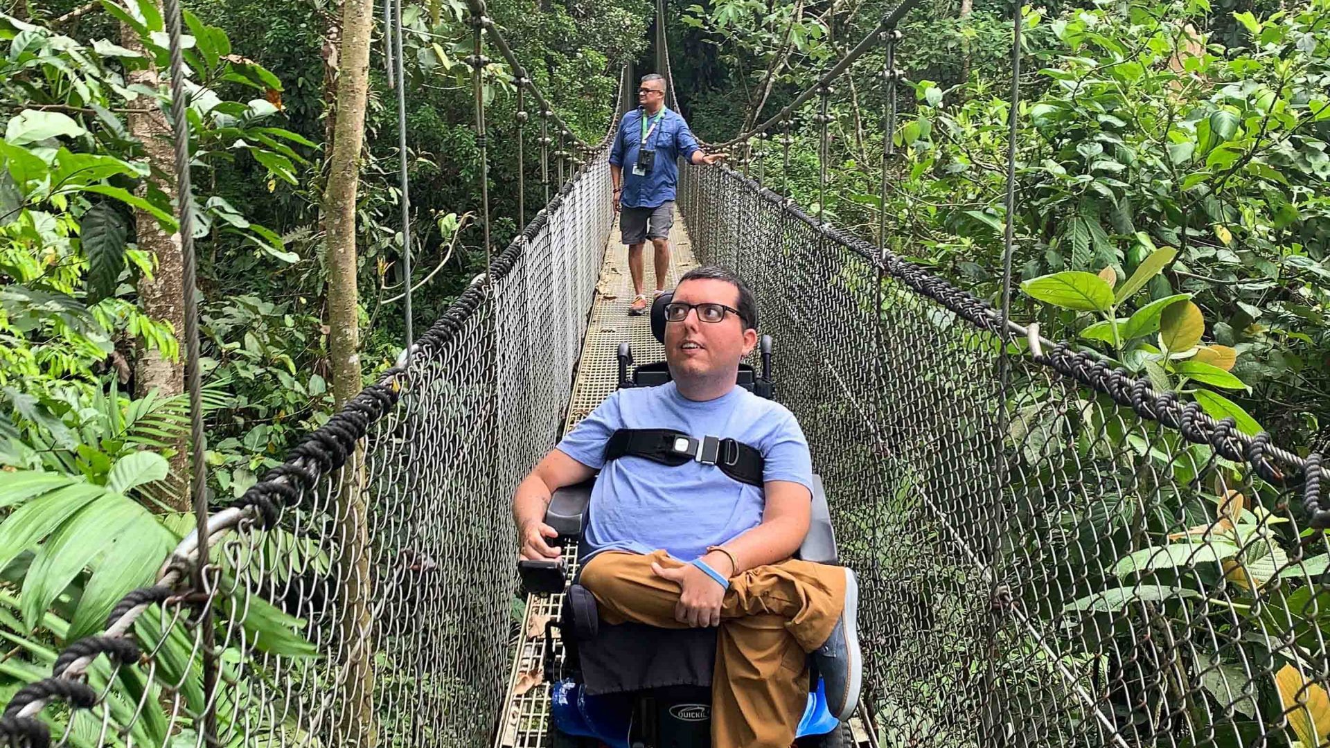Cory Lee crossing a bridge while on his travels.